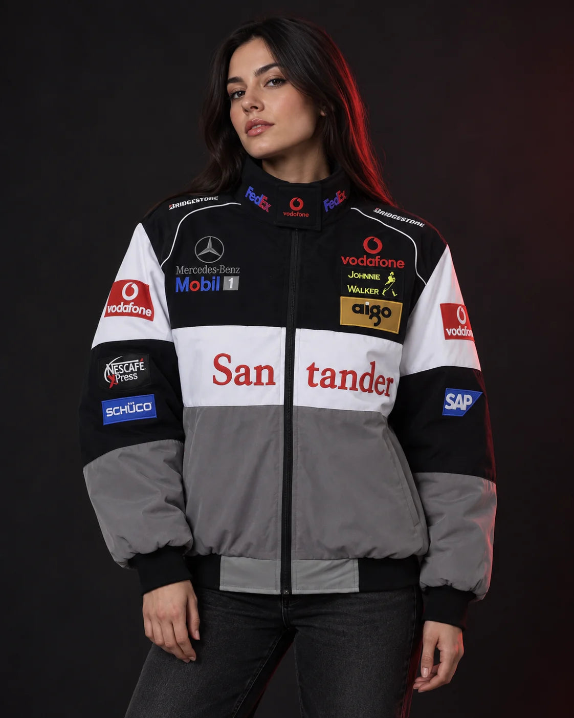 Woman wearing a black, white and grey racing jacket